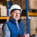 Senior man working in warehouse
