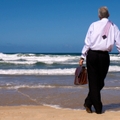 man looking gazing in thought out to sea