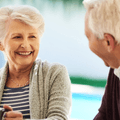 Older couple enjoying breakfast on their patio