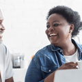 Retired couple on laptop reviewing expenses