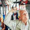 Senior man riding public bus