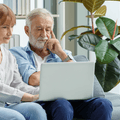 Senior couple looking at retiring and savings