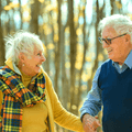 Couple in their 80s on a walk in autumn