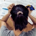 Stressed woman looking at bills