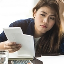 Woman Looking at Taxes