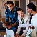 young multi-ethnic business people working at computer desk