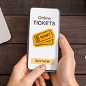 Someone buying tickets on their phone