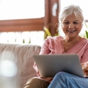 senior couple using laptop at home
