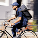 person working delivery gig on bike