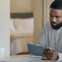Man doing online banking on tablet