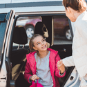 Mom and daughter getting out of car