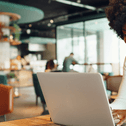 Young woman on laptop at coffee shop