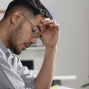 Man looking stressed at computer