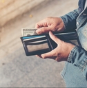 Person pulling money out of wallet