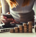 Woman with stack of coins