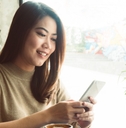 Woman smiling at phone
