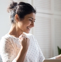 Happy woman looking at paperwork