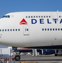 delta airplane parked on tarmac