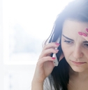 Worried woman talking on the phone