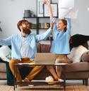 Couple throwing paperwork