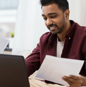 Man using H&amp;R Block tax software