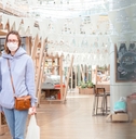 woman shopping in grocery store with mask