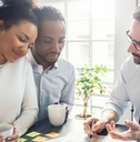 Couple discussing insurance with agent
