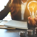 Woman holding light bulb