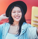 Happy woman taking selfie