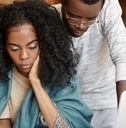 Stressed couple looking at paperwork