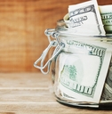 Jar filled with dollar bills