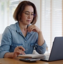Woman contemplating her finances