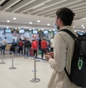 Man at airport in customer service area