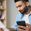 Man looking at check