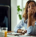 Woman thinking about bills