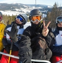 A picture of teenaged skiers on a ski lift