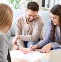 Couple signing loan paperwork