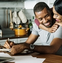 Couple hugging in kitchen