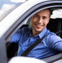 happy man giving thumbs up in car