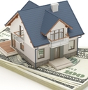 Model house sitting on money