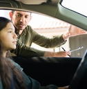 Caucasian teen girl ready to start her driving test