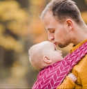 Father and a baby in a baby carrier picture