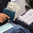 close up traveler hand man getting many cash for travel in the trip 