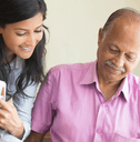 Man and woman talking and looking at paperwork