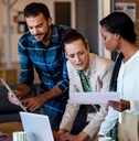 young multi-ethnic business people working at computer desk