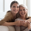 loving daughter hug mother people posing looking at camera