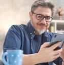 Mature man looking at phone