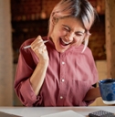 woman who is happy about figuring out her finances