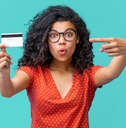 young african american woman in trendy spectacles smiling and holding credit card 
