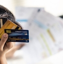 asian young woman being stressed about her credit card debt problems